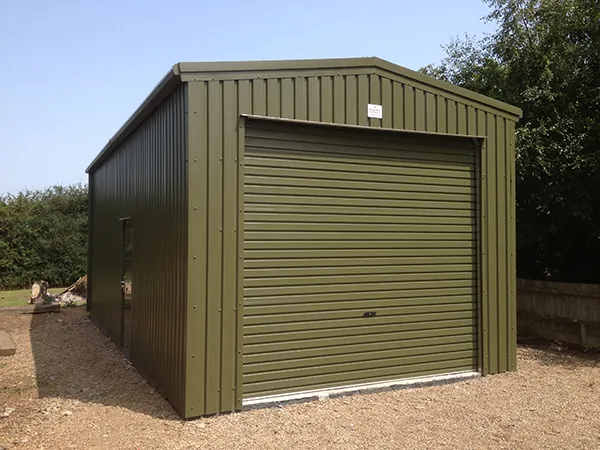 Olive green steel garage with a single roller door
